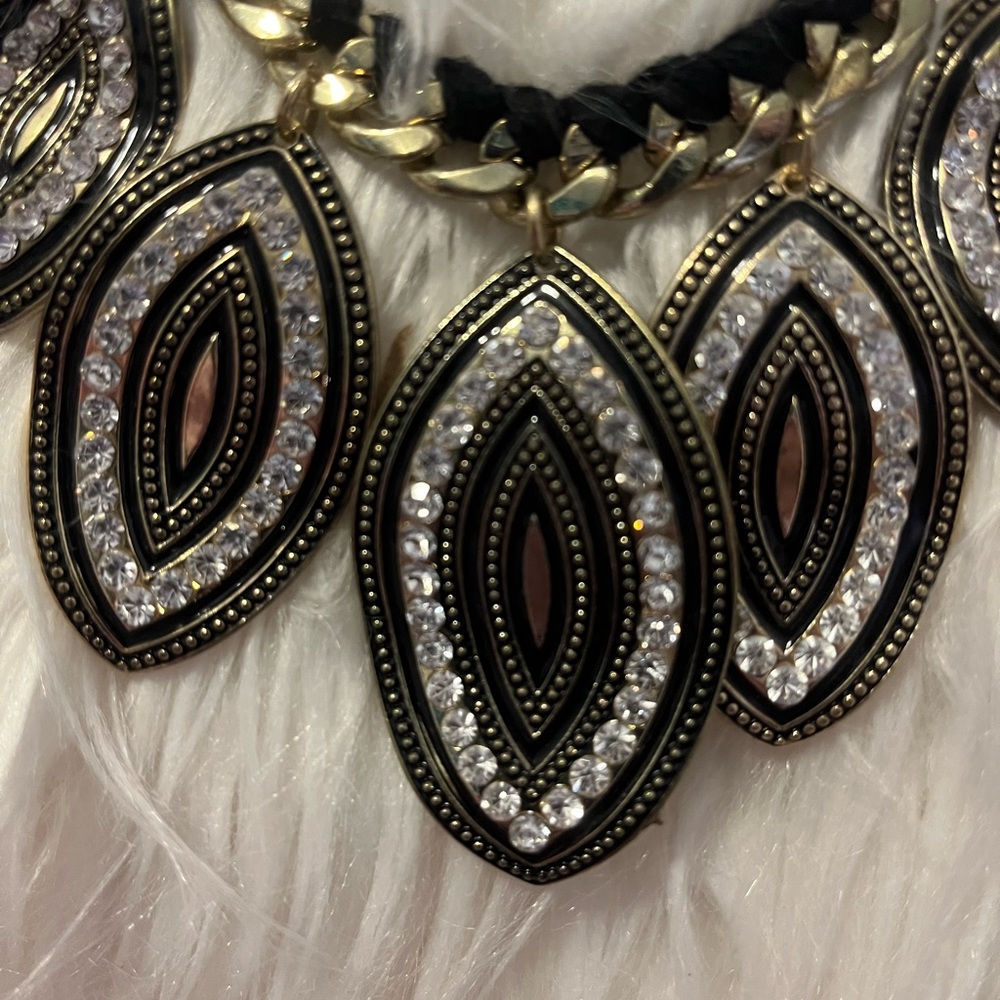 Black, gold, clear crystals.
